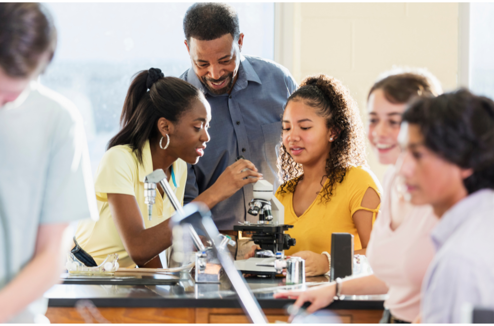 kids looking at a microscope together