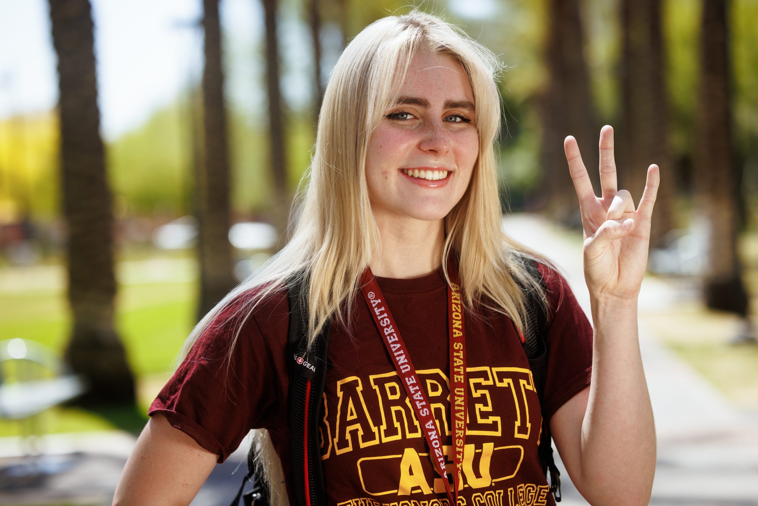 blond teenager in Arizona State University t-shirt